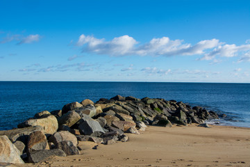 Fototapeta na wymiar Rock Jetty on Beach