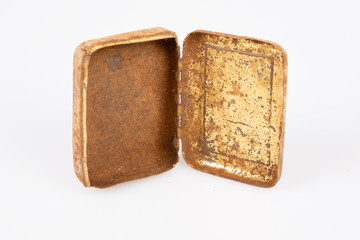 Old rusty metal box isolated on white background