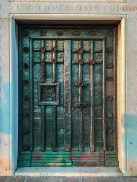 Old door in Florence in dark green bronce