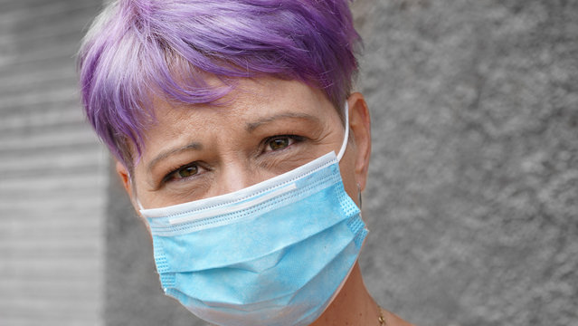 The image face of a woman wearing a mask to prevent germs, toxic fumes, and dust. Prevention of bacterial infection Corona virus or Covid 19 in the air.