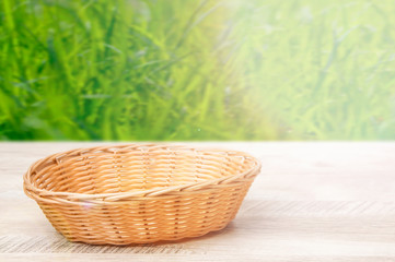 Fototapeta na wymiar Wicker basket on a wooden table