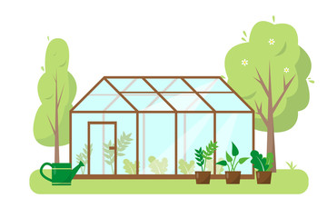 Greenhouse with plants and trees in garden.