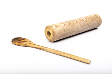 wooden spoon and rolling pin on white background