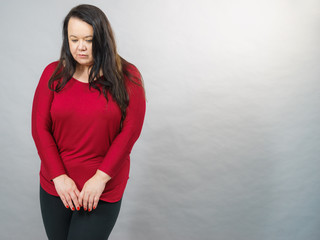 Unhappy sad big woman