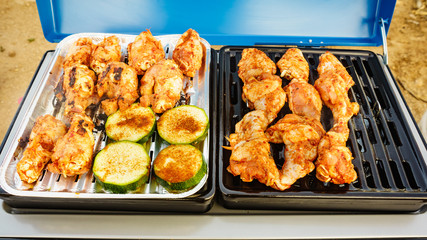 Chicken meat grilling on gas grill