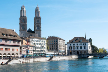 Fototapeta premium View of Grossmunster and Zurich old town from Limmat river. The Grossmunster is a Romanesque-style Protestant church in Zurich
