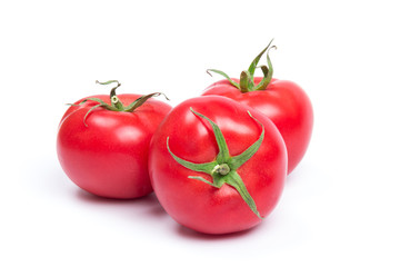 Red fresh tomatoes isolated on white background in close-up