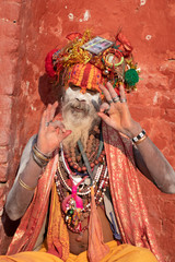 Kathmandu,Nepal Sadhu man with traditional painted face in Pashupatinath Temple.Non english word...