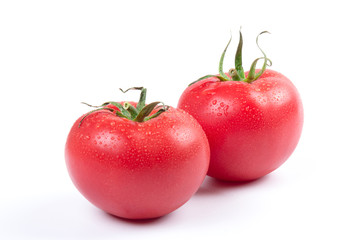 Red fresh tomatoes isolated on white background in close-up