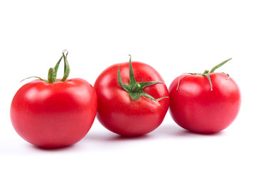 Red fresh tomatoes isolated on white background in close-up