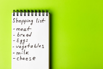  Shopping list for the supermarket on a green background.