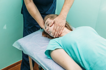 Fototapeta na wymiar young woman getting professional neck treatment at physiotherapist