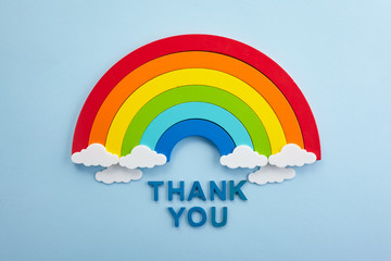 Thank you rainbow banner. Rainbow ob blue background with letters © vetre