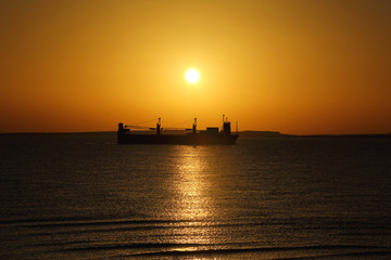 ship on the background of the Golden sunrise