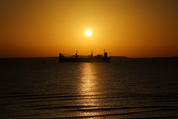 ship on the background of the Golden sunrise
