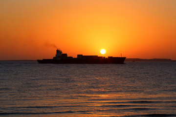 ship on the background of the Golden sunrise