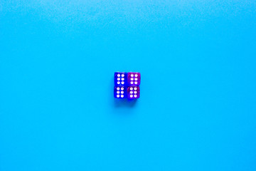Four dices of blue transparent color showing number six on blue background. Free copy space. Concept of game, winning combination. Colored playing cubes. Top view.