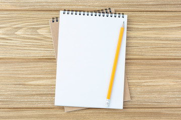 spiral notebook and pencil