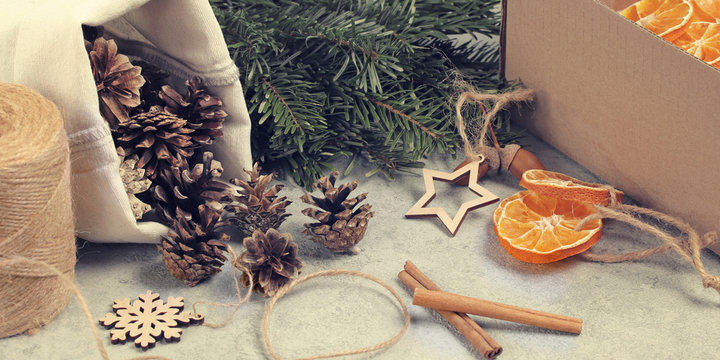 Zero waste and eco friendly christmas concept. Natural decorations and branches of a Christmas tree on the table