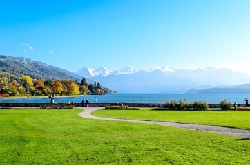Amazing postcard view on Thun Lake (Thunersee, Thuner See), alps mountains Eiger, Jungfrau, Monch...