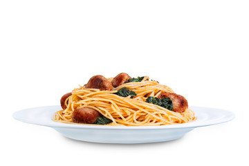 Tomato Spinach Sausage Pasta in a white plate on a white isolated background