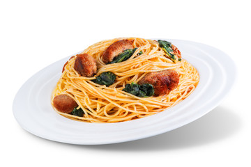 Tomato Spinach Sausage Pasta in a white plate on a white isolated background
