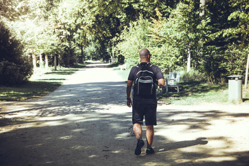 Fototapeta premium Hiker hiking in a park