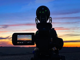 A landscape view thru a camcorder at sunset
