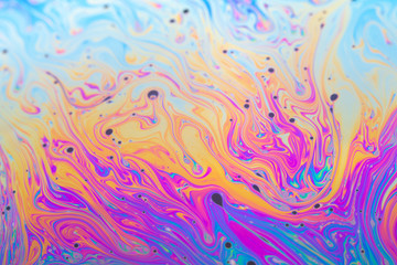 Abstract iridescent background interference light rainbow colors. Soap bubble texture