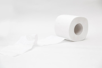 Rolls of white soft new toilet paper stand on white background