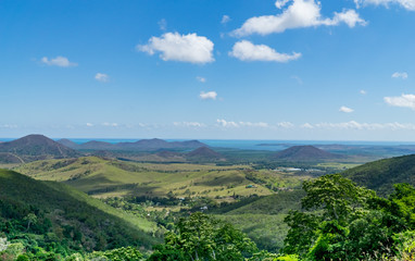 view of the hills of new caledonia; sea in the background