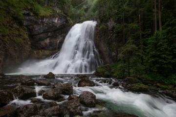 Fototapeta premium Gollinger waterfall in the forest with river Schwarzbach close to Berchtesgaden, Bavaria.