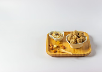 Healthy homemade energy balls with nuts, oats, dried fruit. Vegetarian raw organic food.  Horizontal orientation. Copy space for text