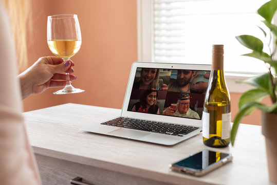 Woman Enjoying A Virtual Happy Hour With Family During Social Distancing