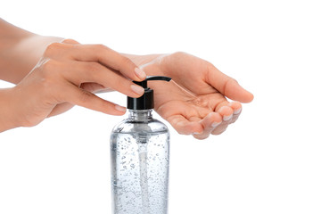 Woman hands, on White empty isolated background using hand sanitizer Large transparent bottle dispenser alcohol gel, coronavirus quarantine, covid-19