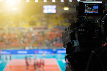 Blurred background of professional volleyball league cup championship international competition live sport news tv show from indoor arena with fans crowd cheer up and watching from stand for victory