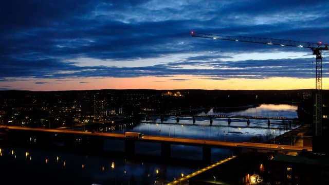 Umea river and bridges at sunset, cityscape, Umea, Sweden
