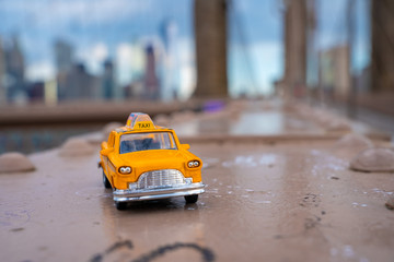 Classical yellow taxi model on an empty Brooklyn Bridge during lockdown in New York, because of the...