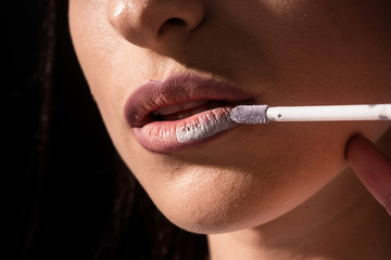 Make up artist applies cosmetics