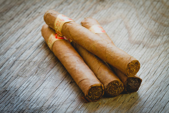 High Angle View Of Cigars On Table