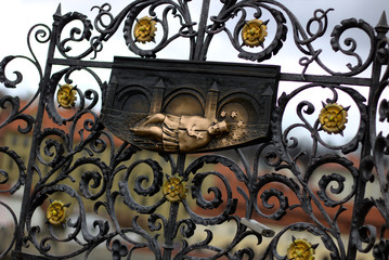 Bronze Sculpture Of Saint John Of Nepomuk On Charles Bridge In Front Of Hradzany Castle And Saint Vitus Cathedral In Prague In The Czech Republic