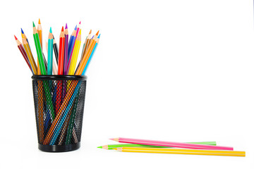 Fototapeta premium Bunch of colored pencils in a pencil holder. Macro still-file picture made in studio with white background and softbox.