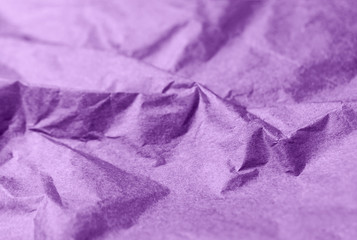 Crumpled purple violet paper texture abstract background