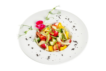 Diet salad made from fresh spring vegetables. Tomatoes, cucumber, peppers, herbs, radishes. We cook at home ourselves.
