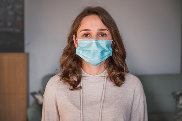 Young woman with disposable face mask