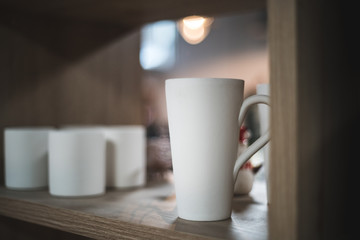 Ceramic Cups and Mugs on a shelf