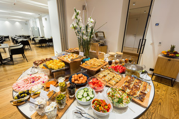 Breakfast served on buffet table in hotel restaurant