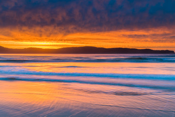 Fototapeta na wymiar Stratocumulus Cloud Covered Sunrise Seascape