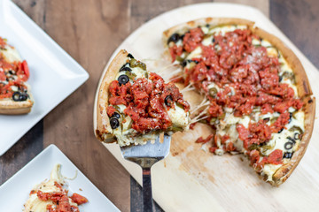 Closeup of deep dish pizza being served