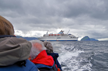 Classic cruiseship or cruise ship liner cruising to Natural Reserve and Wildlife destination Faroe...